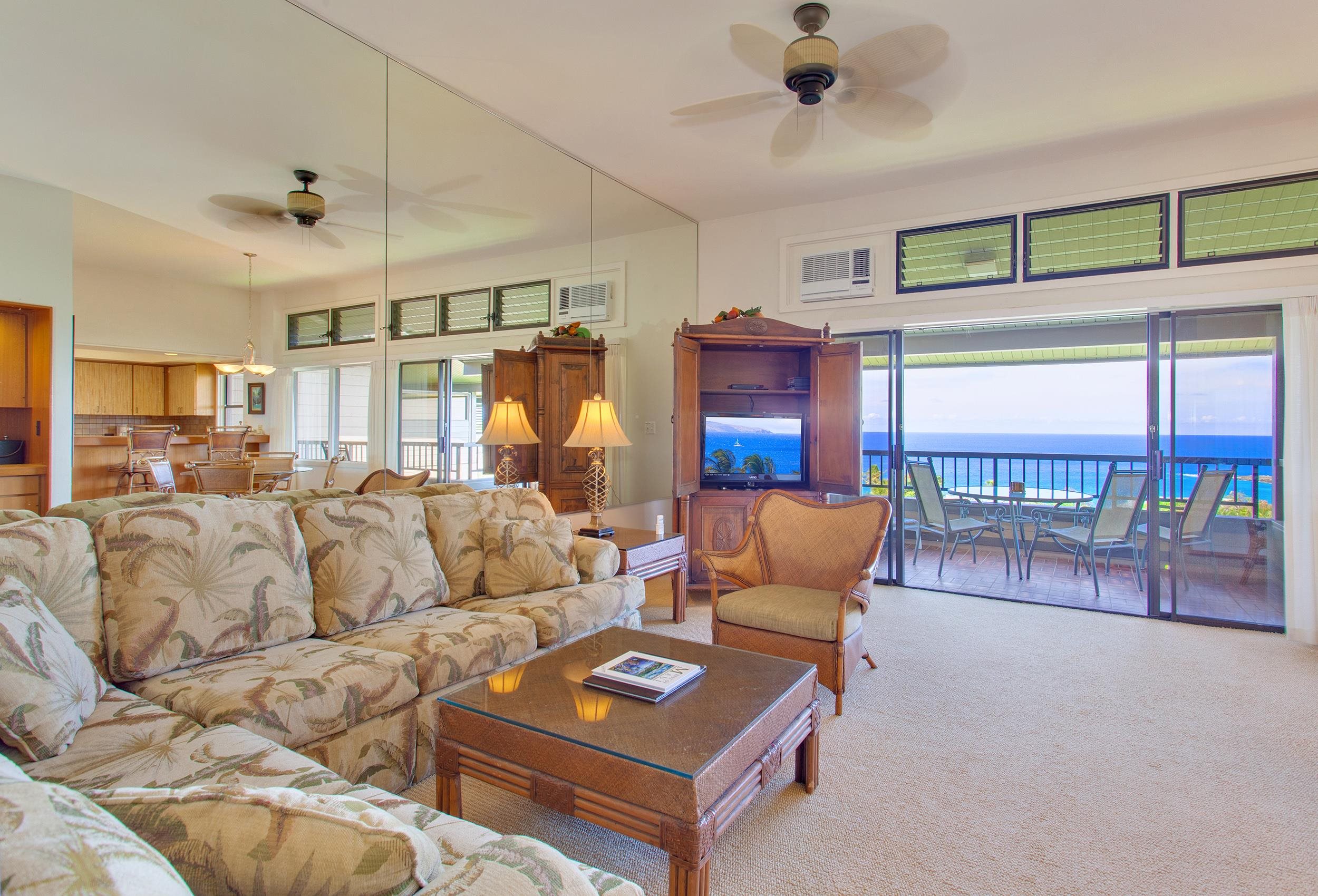 100 Ridge Road, Unit 321 Lahaina, HI 96761 - Photo 5 of 30 a living room with furniture and a floor to ceiling window