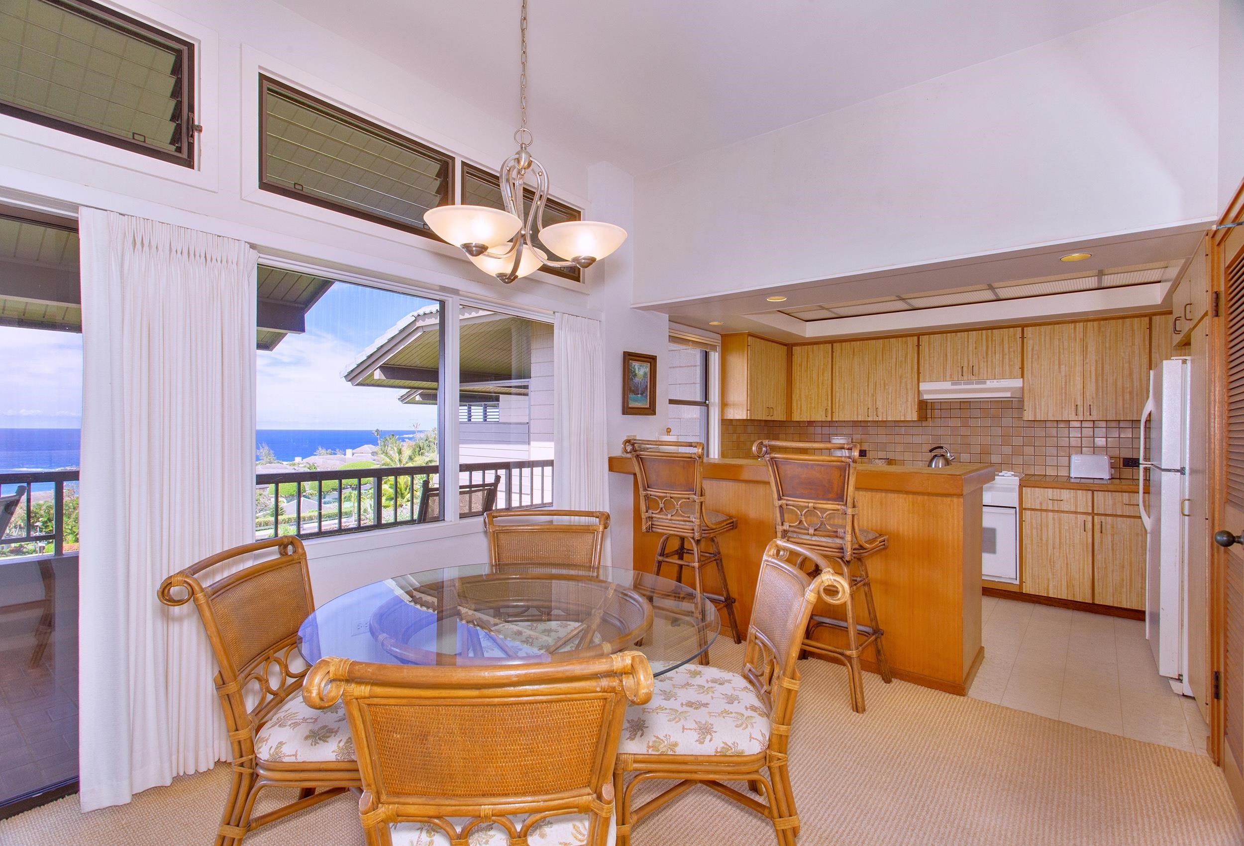 100 Ridge Road, Unit 321 Lahaina, HI 96761 - Photo 9 of 30 a view of a dining room with furniture and a chandelier