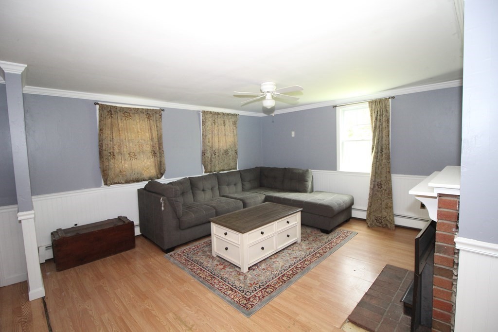 91 Davis Road Westminster, MA 01473 - Photo 11 of 37 a living room with furniture and a lamp