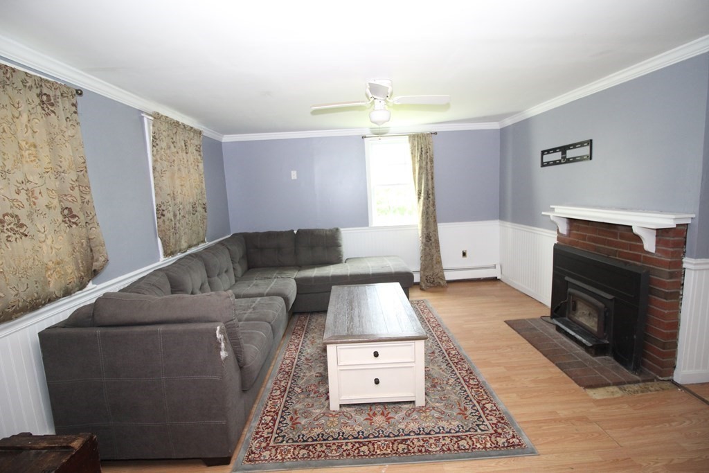 91 Davis Road Westminster, MA 01473 - Photo 12 of 37 a living room with furniture and a fireplace