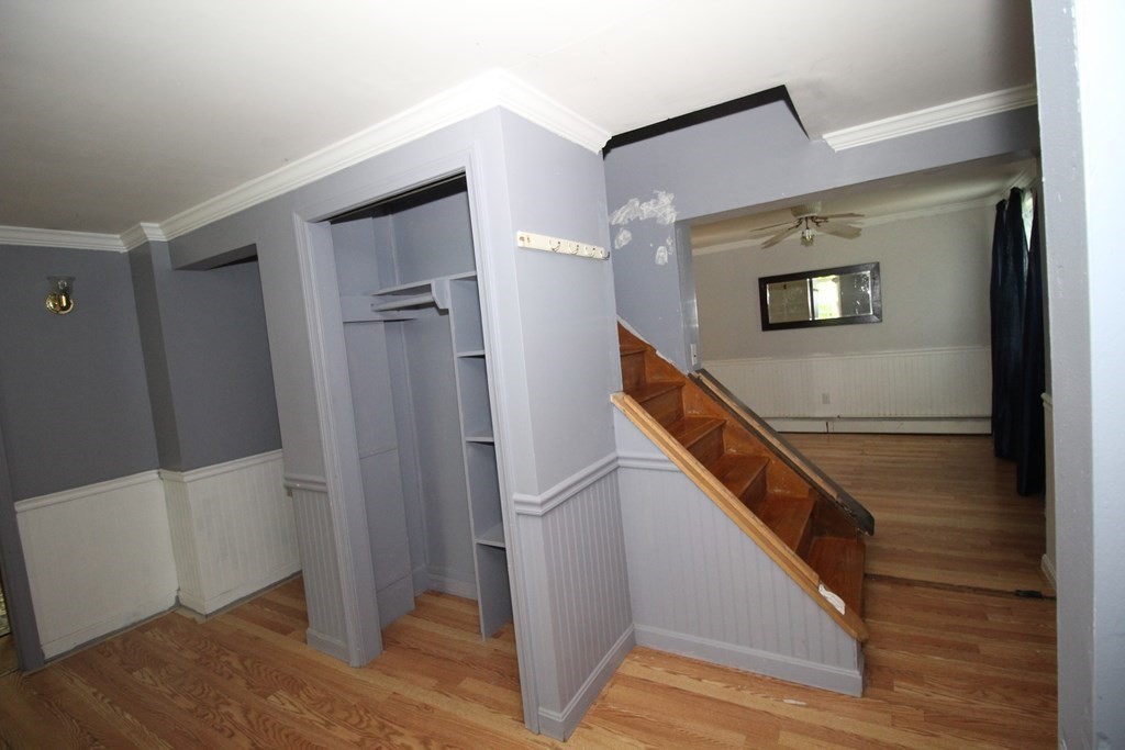 91 Davis Road Westminster, MA 01473 - Photo 13 of 37 a hallway with front door and wooden floor