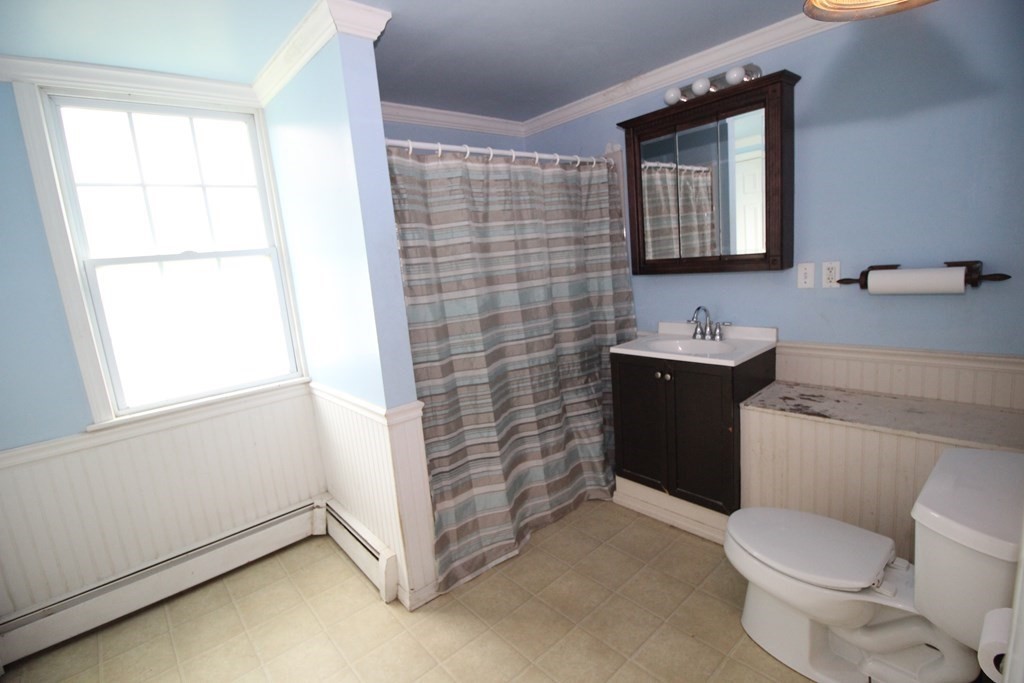 91 Davis Road Westminster, MA 01473 - Photo 14 of 37 a bathroom with a toilet sink and mirror