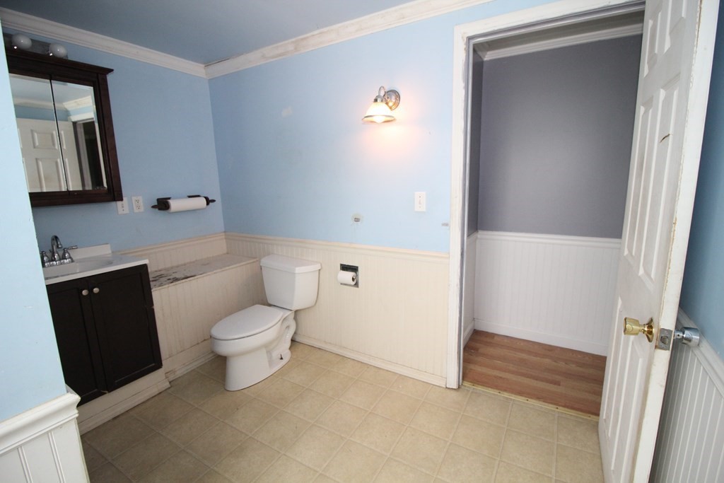 91 Davis Road Westminster, MA 01473 - Photo 15 of 37 a bathroom with a granite countertop toilet and sink