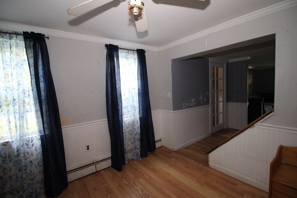 91 Davis Road Westminster, MA 01473 - Photo 19 of 37 an empty room with wooden floor and windows