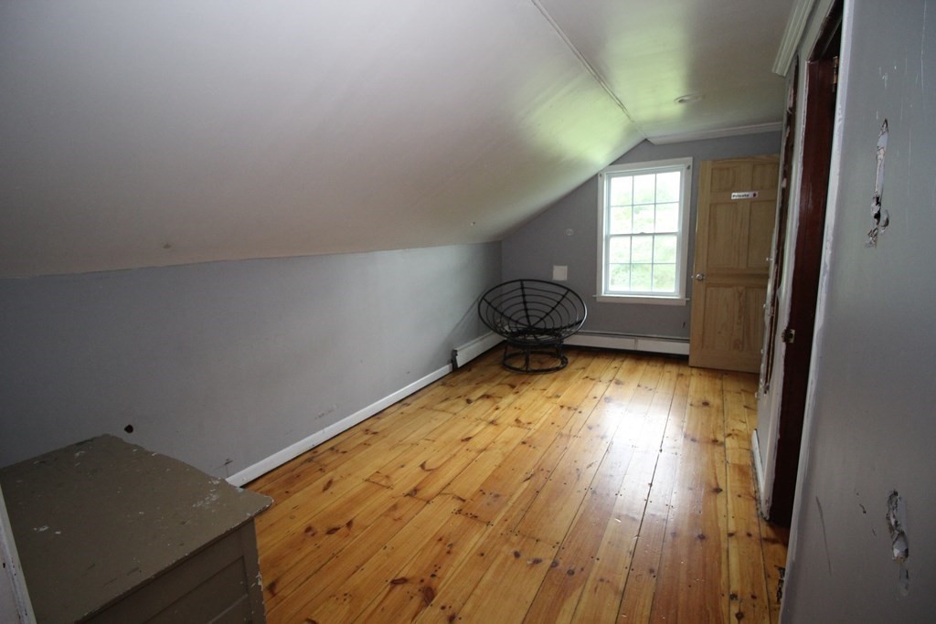 91 Davis Road Westminster, MA 01473 - Photo 21 of 37 wooden floor in an empty room with a window