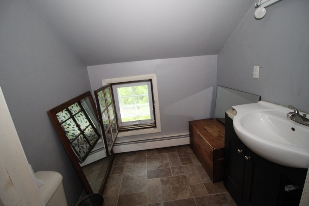 91 Davis Road Westminster, MA 01473 - Photo 27 of 37 a bathroom with a sink and a mirror