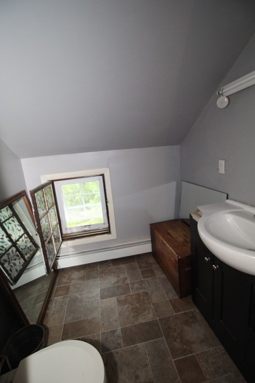 91 Davis Road Westminster, MA 01473 - Photo 28 of 37 a bathroom with a toilet sink and mirror
