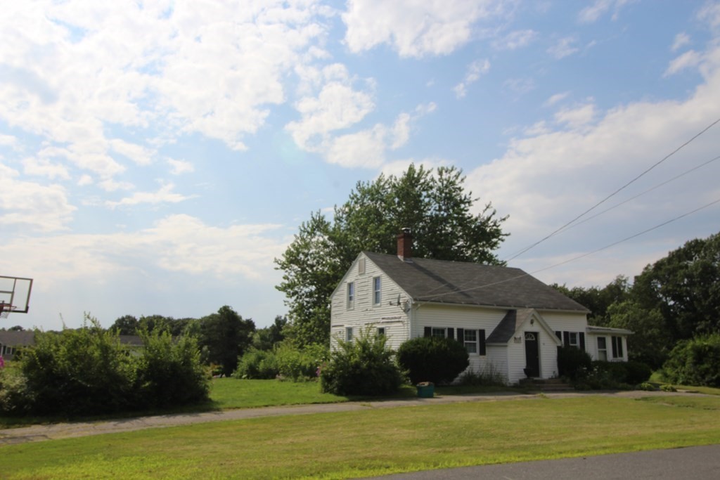 91 Davis Road Westminster, MA 01473 - Photo 3 of 37 a front view of a house with a garden