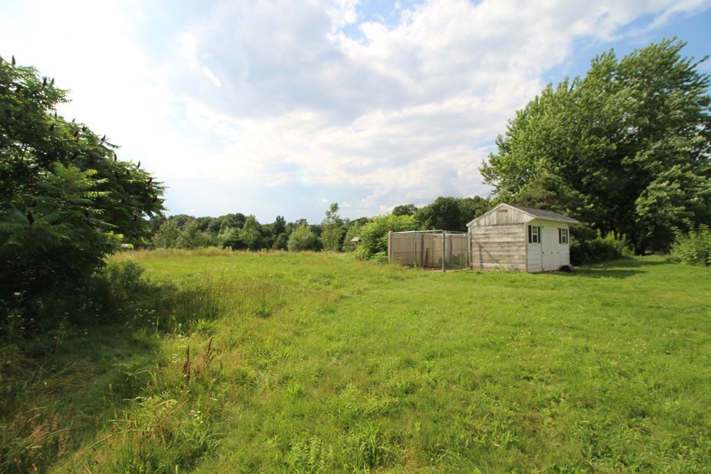 91 Davis Road Westminster, MA 01473 - Photo 34 of 37 a backyard of a house with lots of green space and lake view