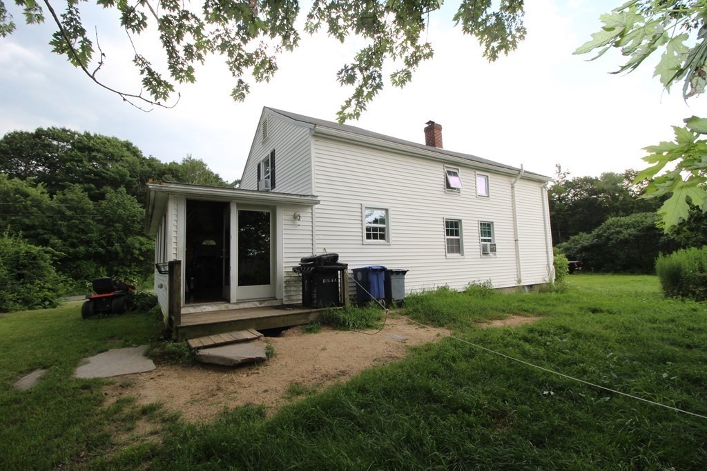 91 Davis Road Westminster, MA 01473 - Photo 36 of 37 a view of a house with backyard porch and garden
