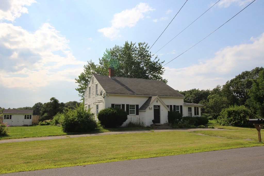 91 Davis Road Westminster, MA 01473 - Photo 5 of 37 a front view of a house with a garden