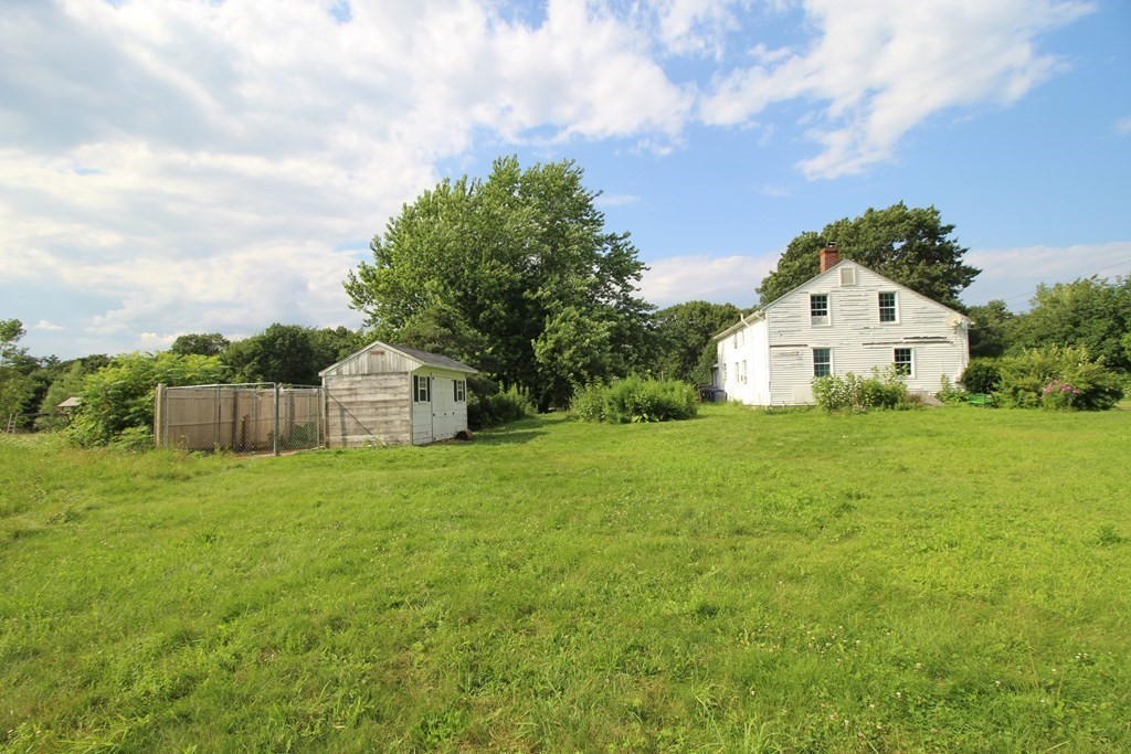 91 Davis Road Westminster, MA 01473 - Photo 8 of 37 a white house with a big yard and large trees