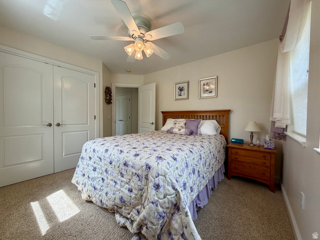 1133 Paris Canyon Road Paris, ID 83261 - Photo 17 of 75 Carpeted bedroom featuring a ceiling fan with integrated lighting, a window with blinds, and white interior doors with arched paneling