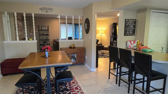 a view of a dining room with furniture and window