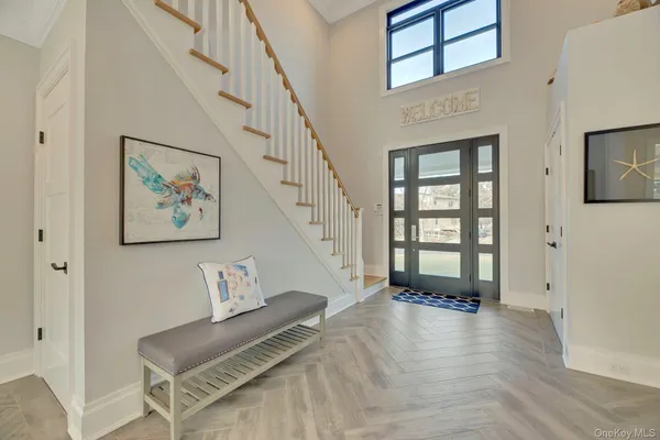 a view of an entryway with wooden floor