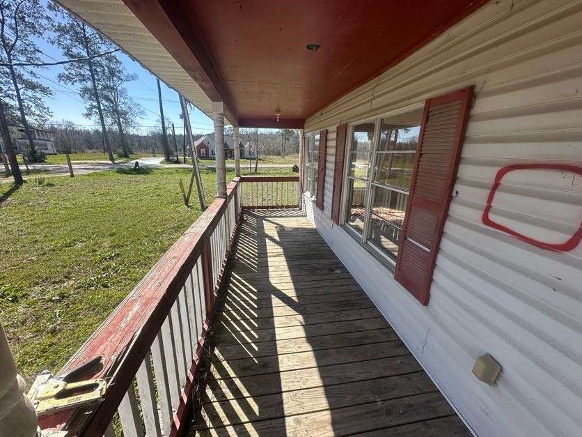 7730 Tram Road Beaumont, TX 77713 - Photo 2 of 9 a balcony with view of swimming pool