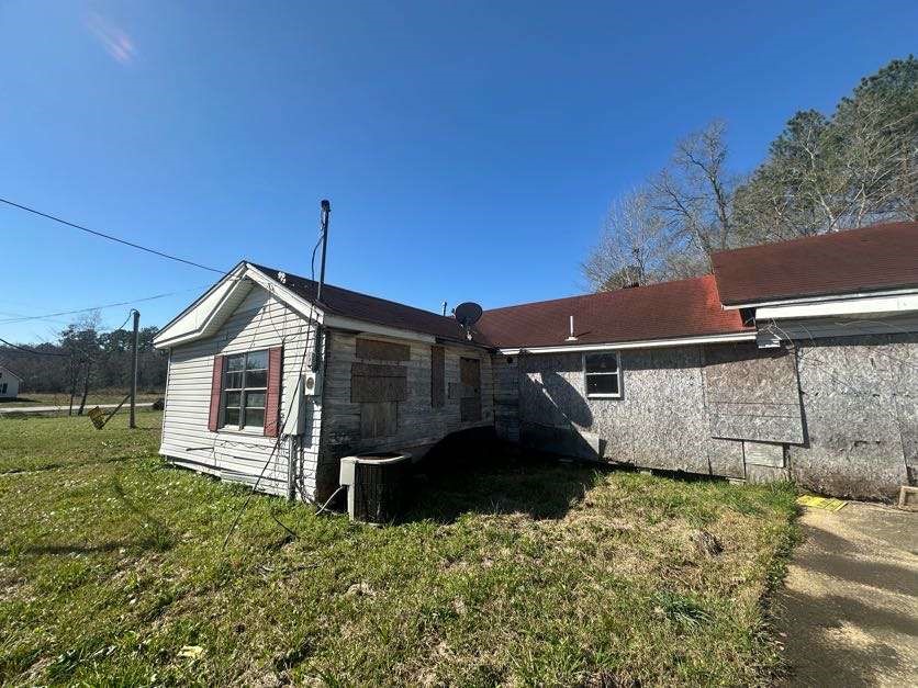 7730 Tram Road Beaumont, TX 77713 - Photo 8 of 9 a view of a house with a yard