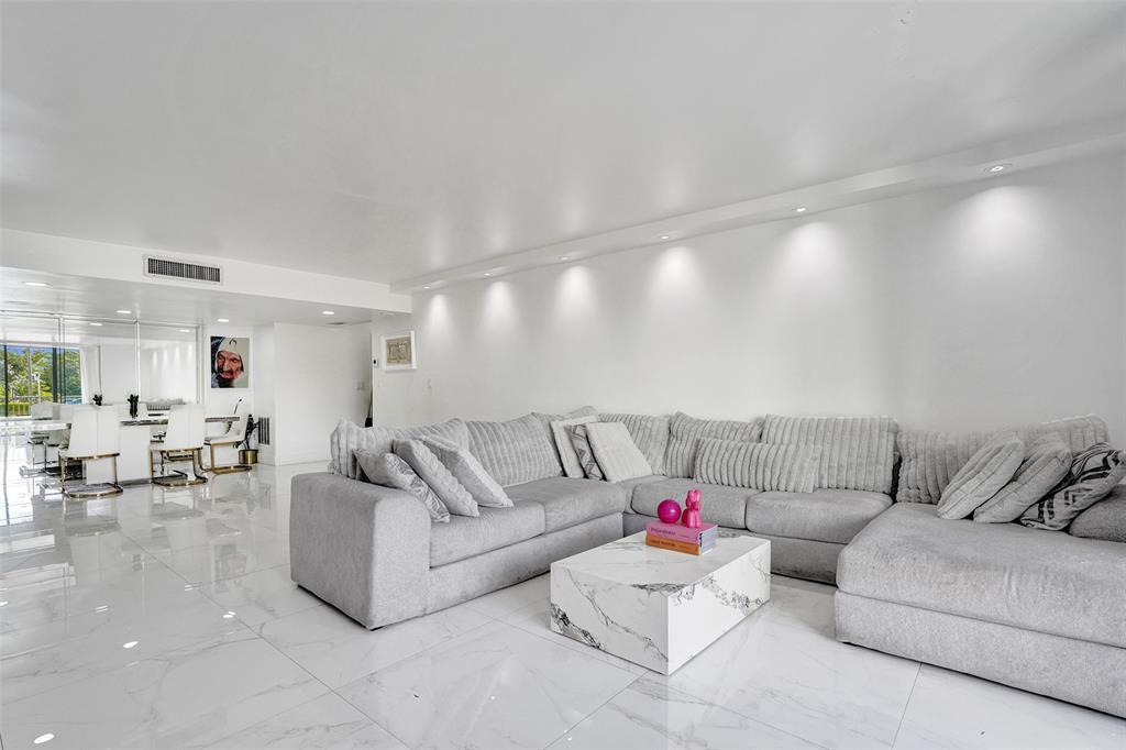 2801 Northeast 183rd Street, Unit 101W Aventura, FL 33160 - Photo 24 of 39 a living room with furniture and white couch