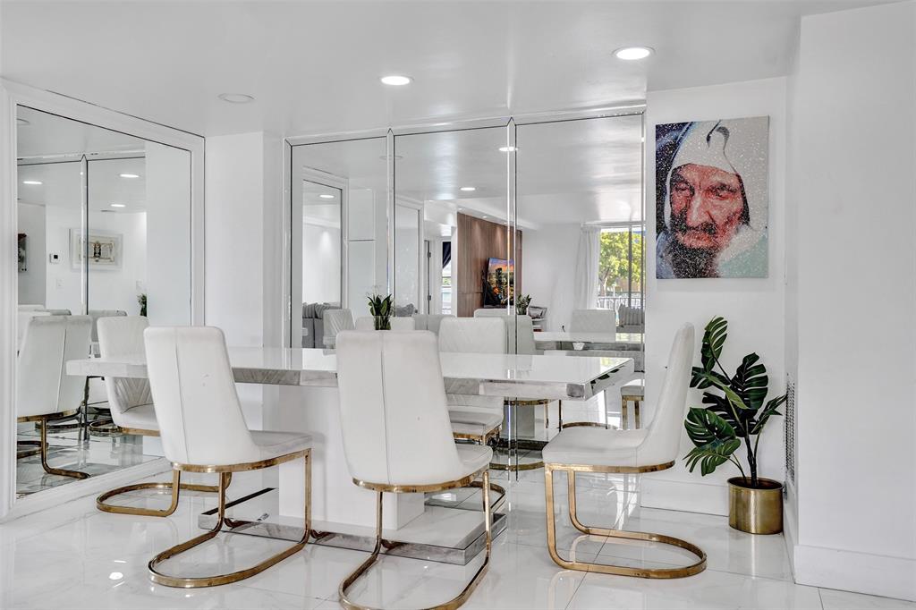 2801 Northeast 183rd Street, Unit 101W Aventura, FL 33160 - Photo 27 of 39 a view of a dining room with furniture