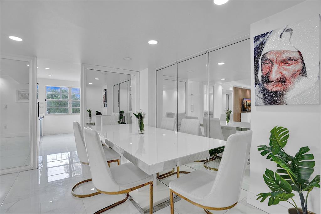 2801 Northeast 183rd Street, Unit 101W Aventura, FL 33160 - Photo 29 of 39 a view of a dining room with furniture