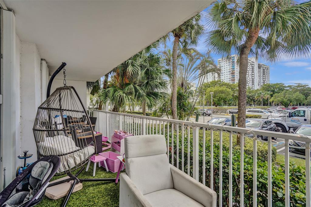 2801 Northeast 183rd Street, Unit 101W Aventura, FL 33160 - Photo 32 of 39 a view of balcony with furniture