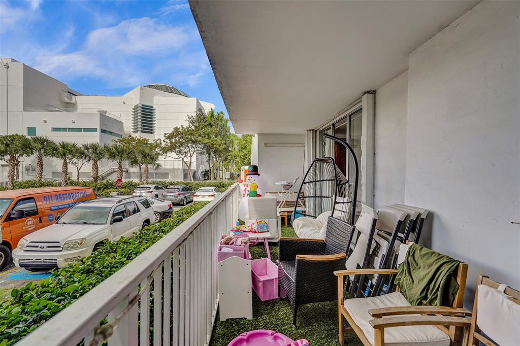 2801 Northeast 183rd Street, Unit 101W Aventura, FL 33160 - Photo 35 of 39 a view of balcony with furniture