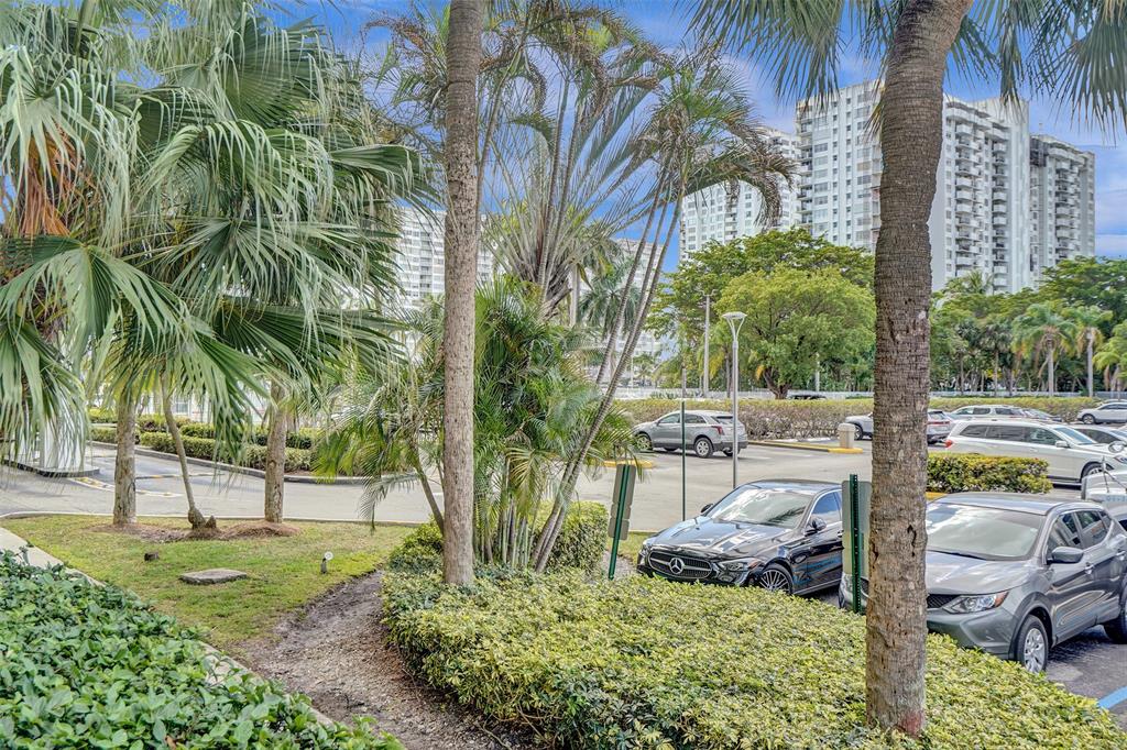 2801 Northeast 183rd Street, Unit 101W Aventura, FL 33160 - Photo 37 of 39 a view of a yard with plants and trees
