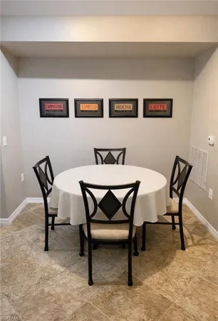 a view of a dining room with furniture