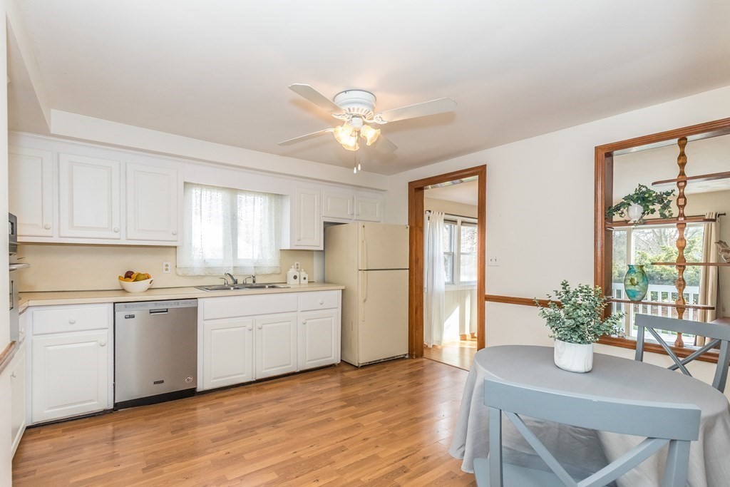 373 Andover Road Billerica, MA 01821 - Photo 11 of 23 a kitchen with a table and refrigerator