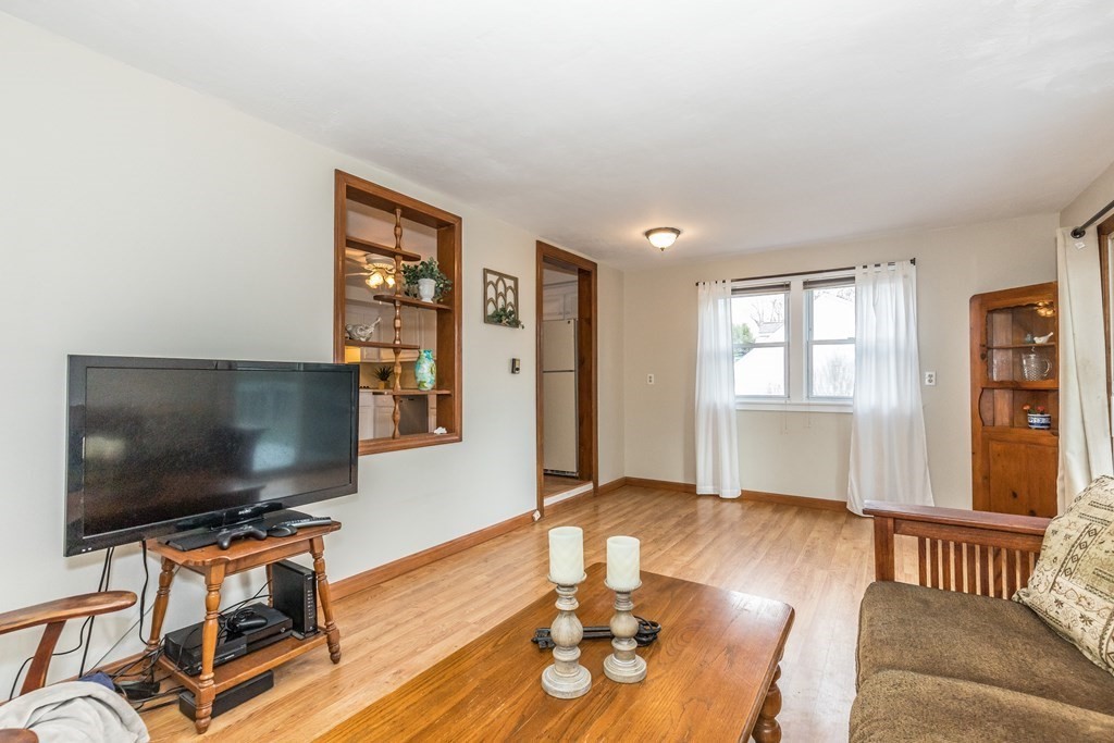 373 Andover Road Billerica, MA 01821 - Photo 14 of 23 a living room with furniture and a flat screen tv