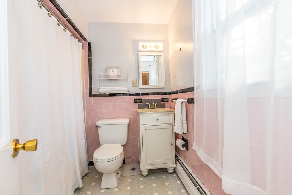 373 Andover Road Billerica, MA 01821 - Photo 17 of 23 a bathroom with a toilet sink and mirror