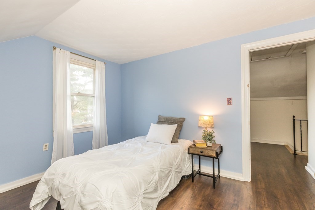 373 Andover Road Billerica, MA 01821 - Photo 19 of 23 a bedroom with a bed and wooden floor