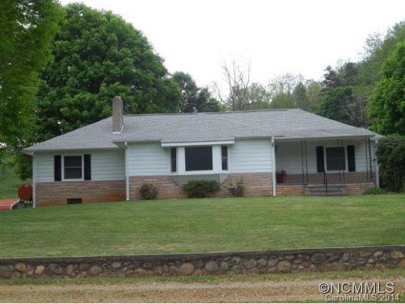 2078 Murray Road Canton, NC 28716 - Photo 1 of 20 a front view of a house with a yard and garage