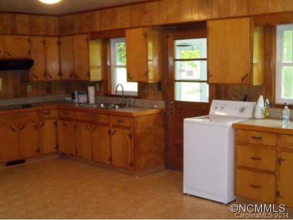 2078 Murray Road Canton, NC 28716 - Photo 9 of 20 a kitchen with a sink cabinets appliances and a window