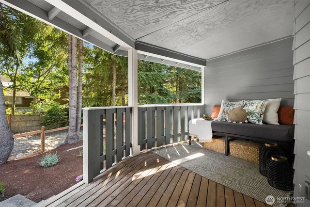 a view of a balcony with furniture