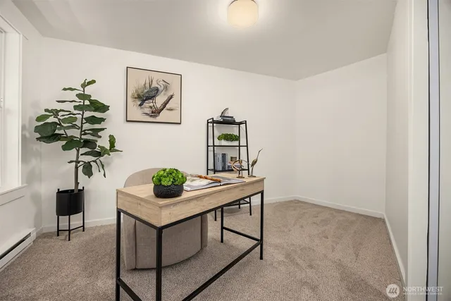 a view of a workspace with furniture