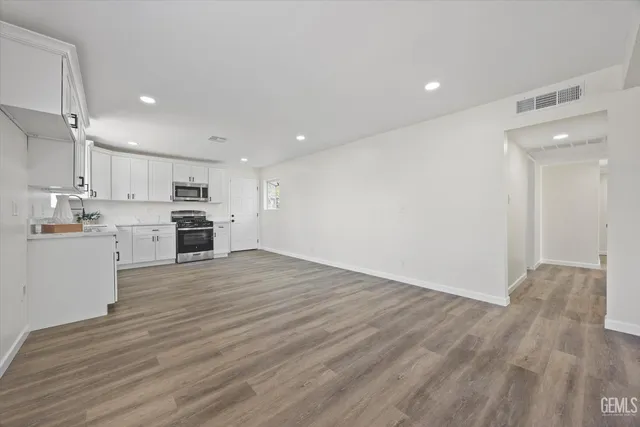 a view of kitchen with wooden floor