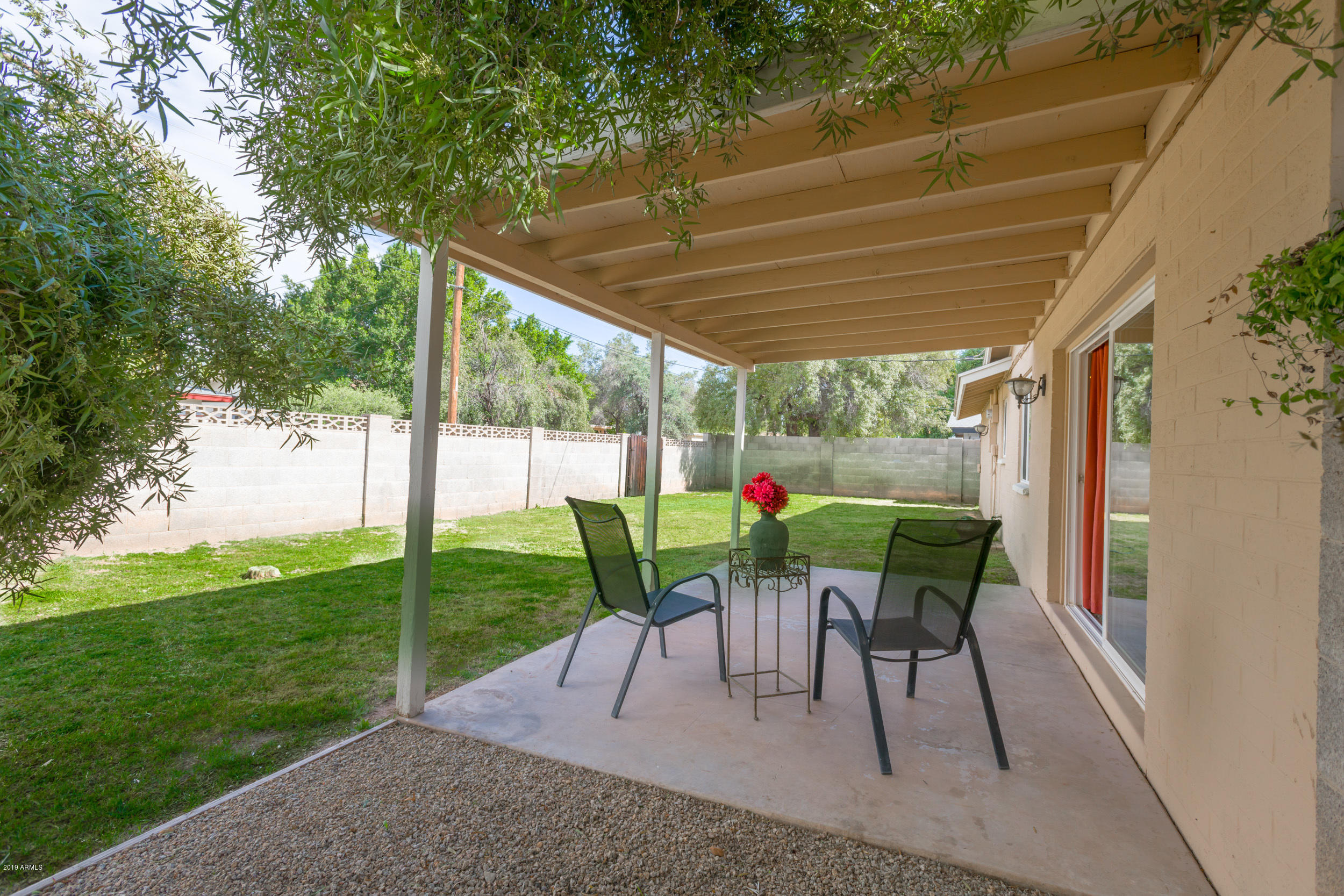 3517 South Terrace Road Tempe, AZ 85282 - Photo 24 of 31 a view of a back yard with a table and chairs