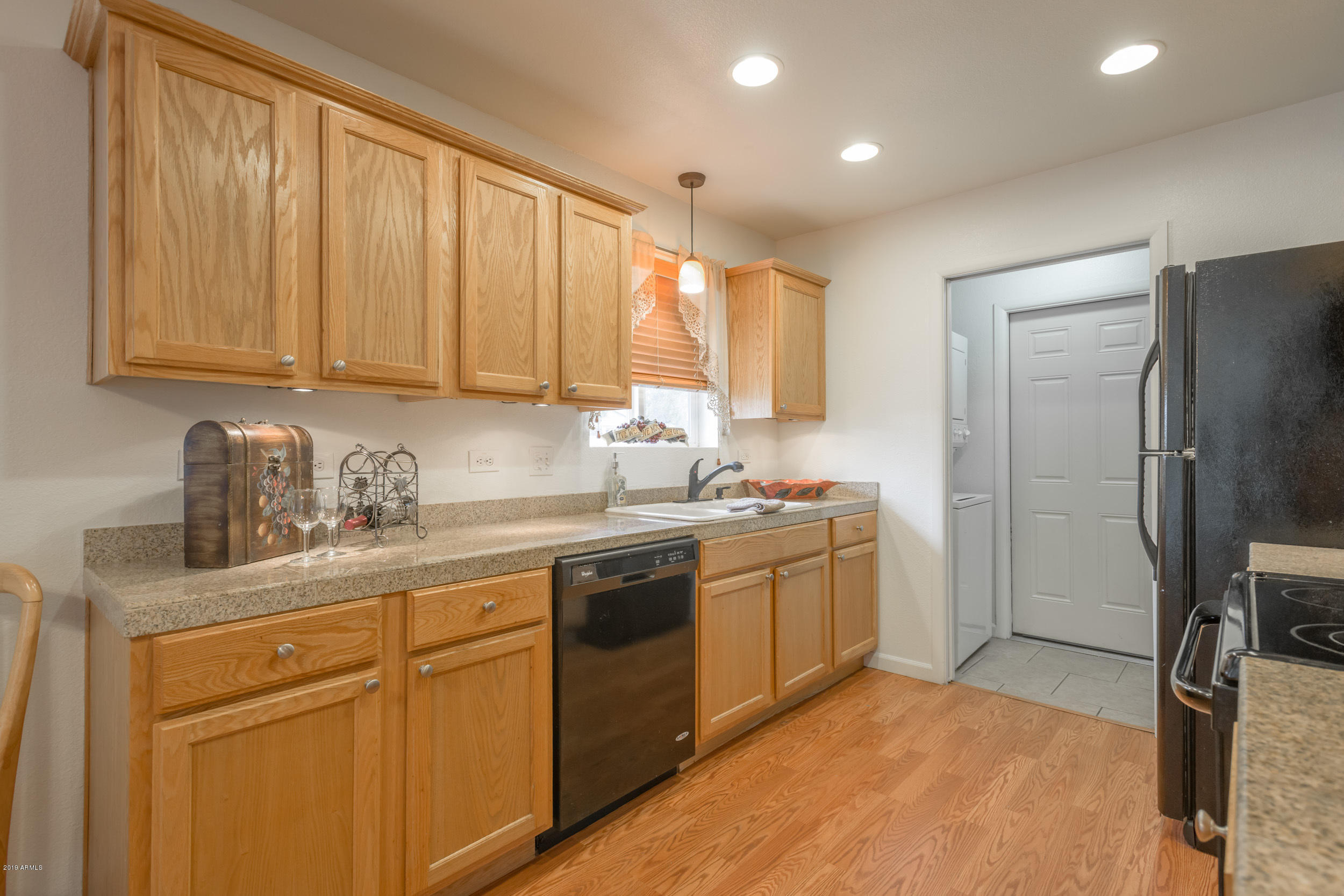 3517 South Terrace Road Tempe, AZ 85282 - Photo 7 of 31 a kitchen with stainless steel appliances granite countertop a sink stove and refrigerator