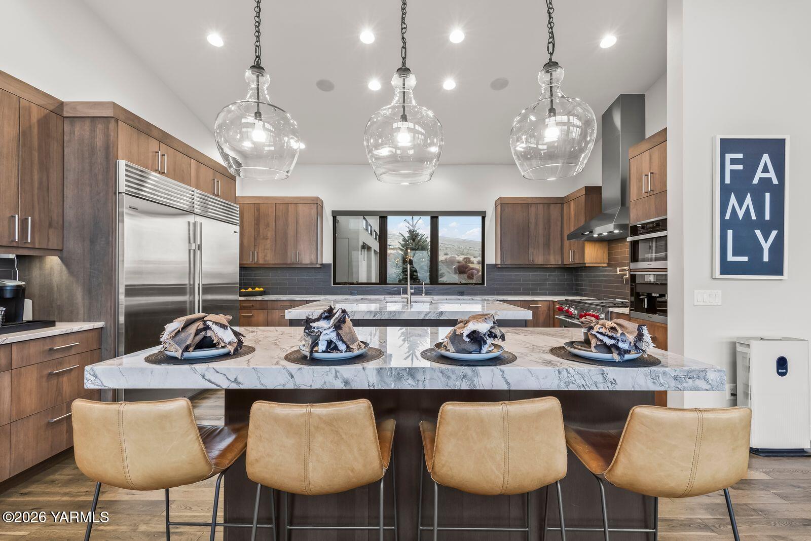 13990 Marble Road Yakima, WA 98908 - Photo 16 of 60 a kitchen with granite countertop a table and chairs in it