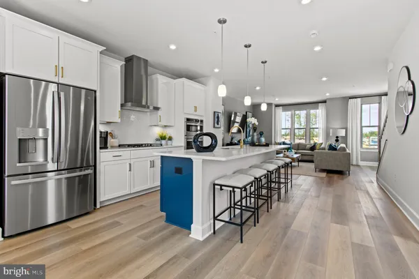 a kitchen with counter top space a sink appliances and cabinets