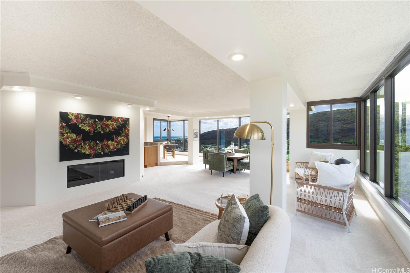 250 Kawaihae Street, Unit 14E Honolulu, HI 96825 - Photo 1 of 1 a living room with furniture and a flat screen tv