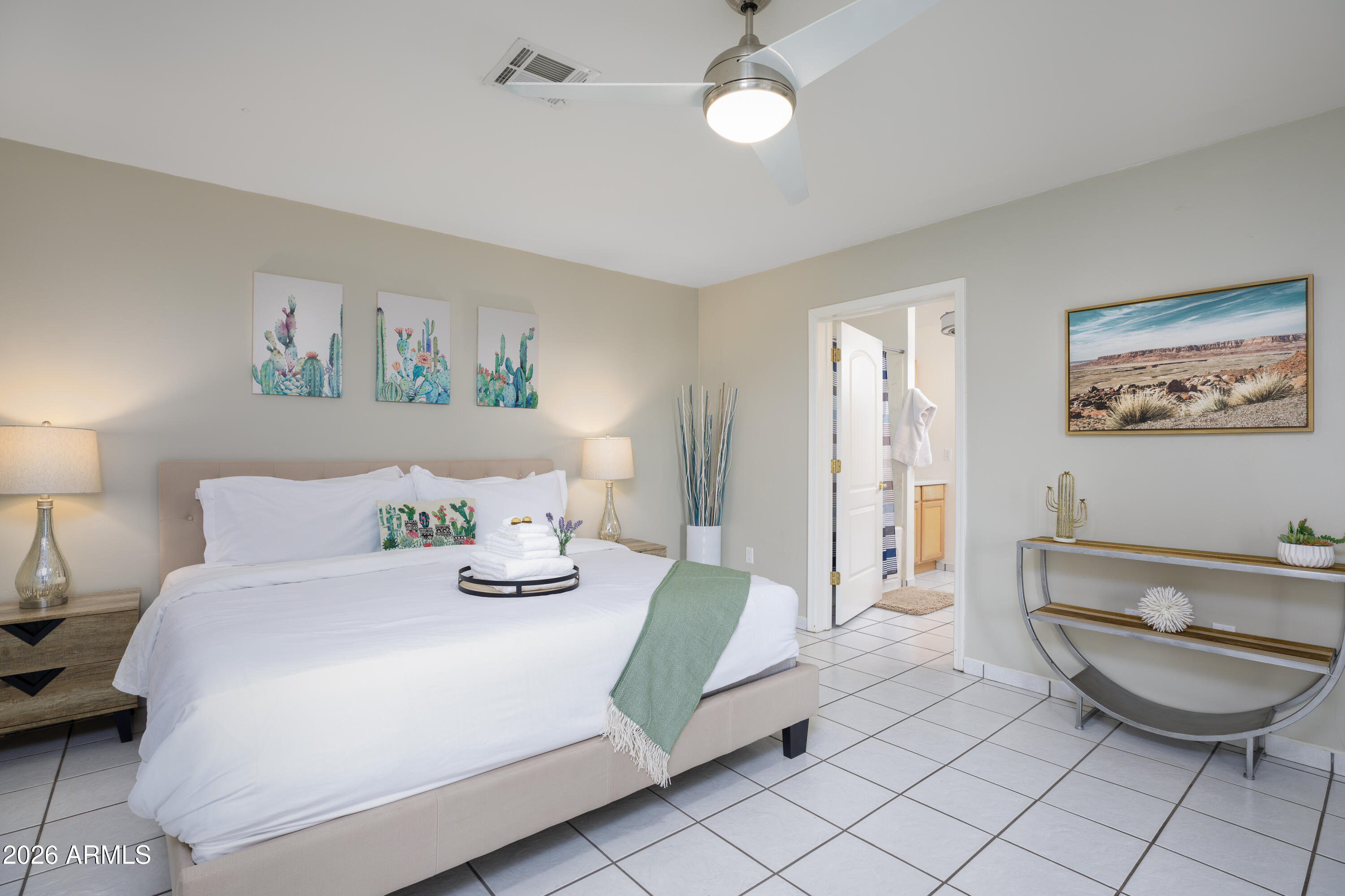 6932 East Presidio Road Scottsdale, AZ 85254 - Photo 22 of 30 a bedroom with a bed and a couch