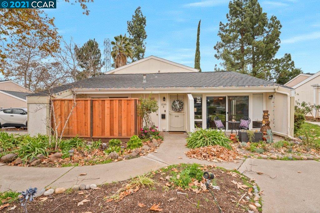 1255 Kenwal Road, Unit D Concord, CA 94521 - Photo 1 of 1 a front view of a house with garden