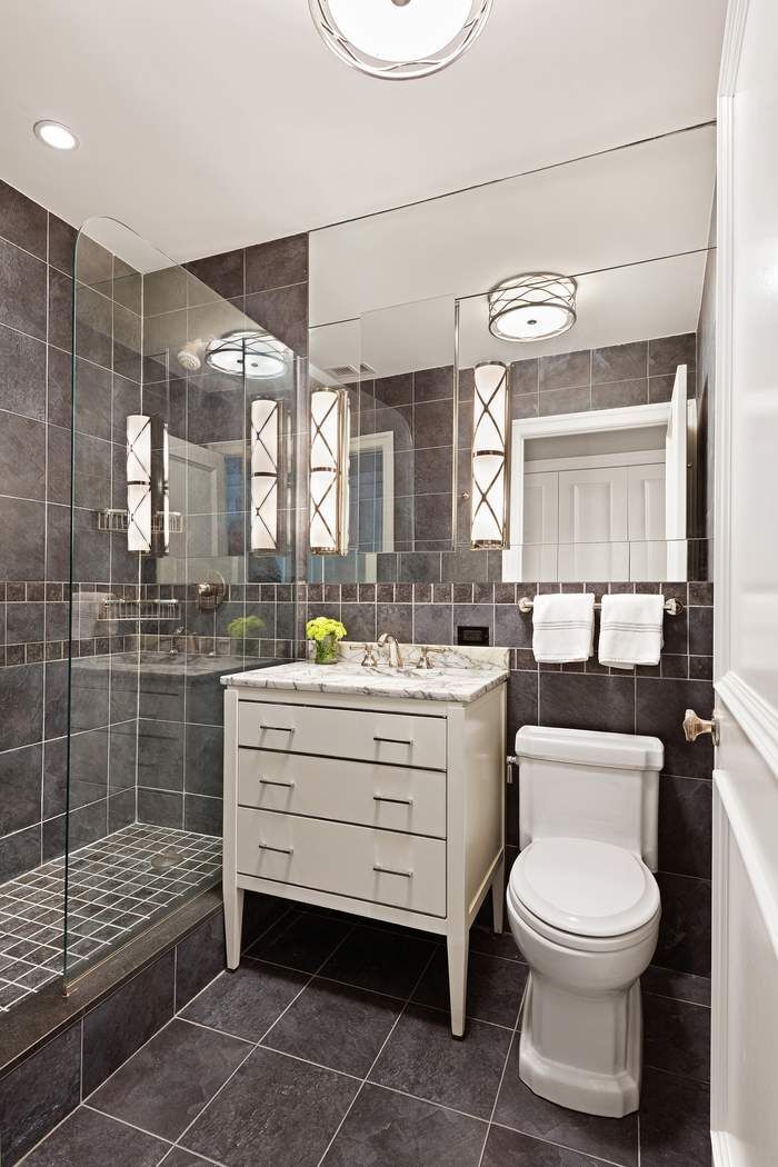 201 East 80th Street, Unit 3D Manhattan, NY 10075 - Photo 10 of 16 a bathroom with a toilet a sink and mirror