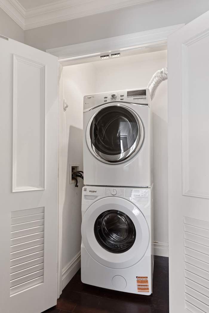 201 East 80th Street, Unit 3D Manhattan, NY 10075 - Photo 12 of 16 a utility room with dryer and washer