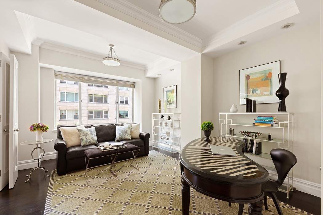201 East 80th Street, Unit 3D Manhattan, NY 10075 - Photo 4 of 16 a living room with furniture and wooden floor