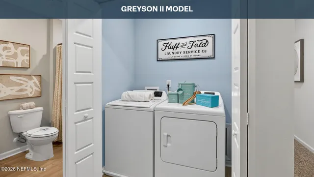 a view of bathroom with a toilet and a sink
