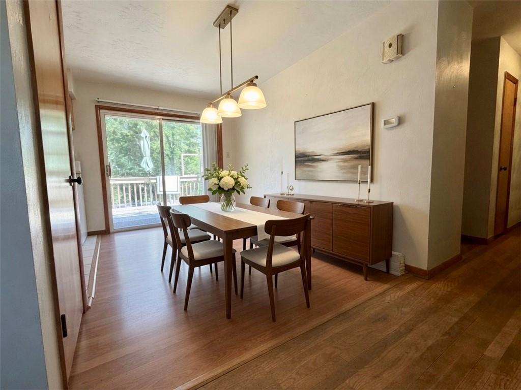 121 Kemar Drive Butler, PA 16002 - Photo 9 of 31 a view of a dining room with furniture window and wooden floor