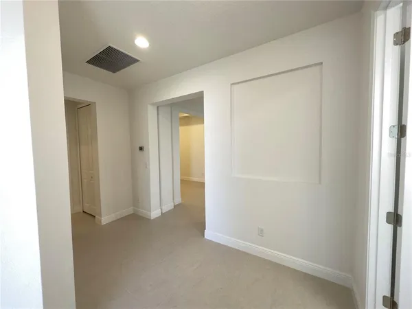 an empty room with closet area